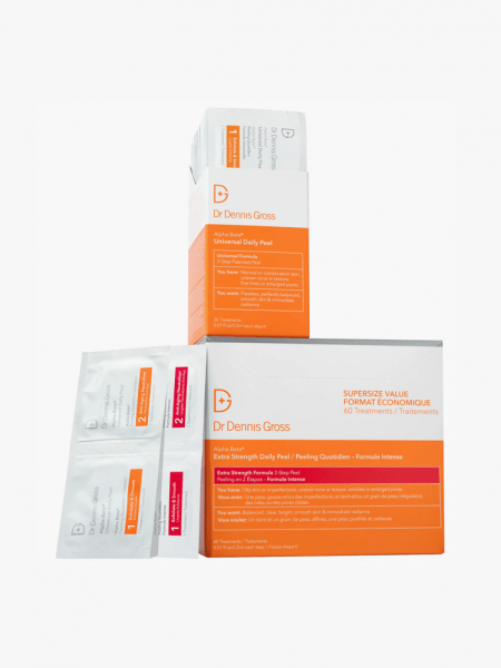 Dr. Dennis Gross Skincare Glow, Brighten & Smooth Set in branded components on a light gray background